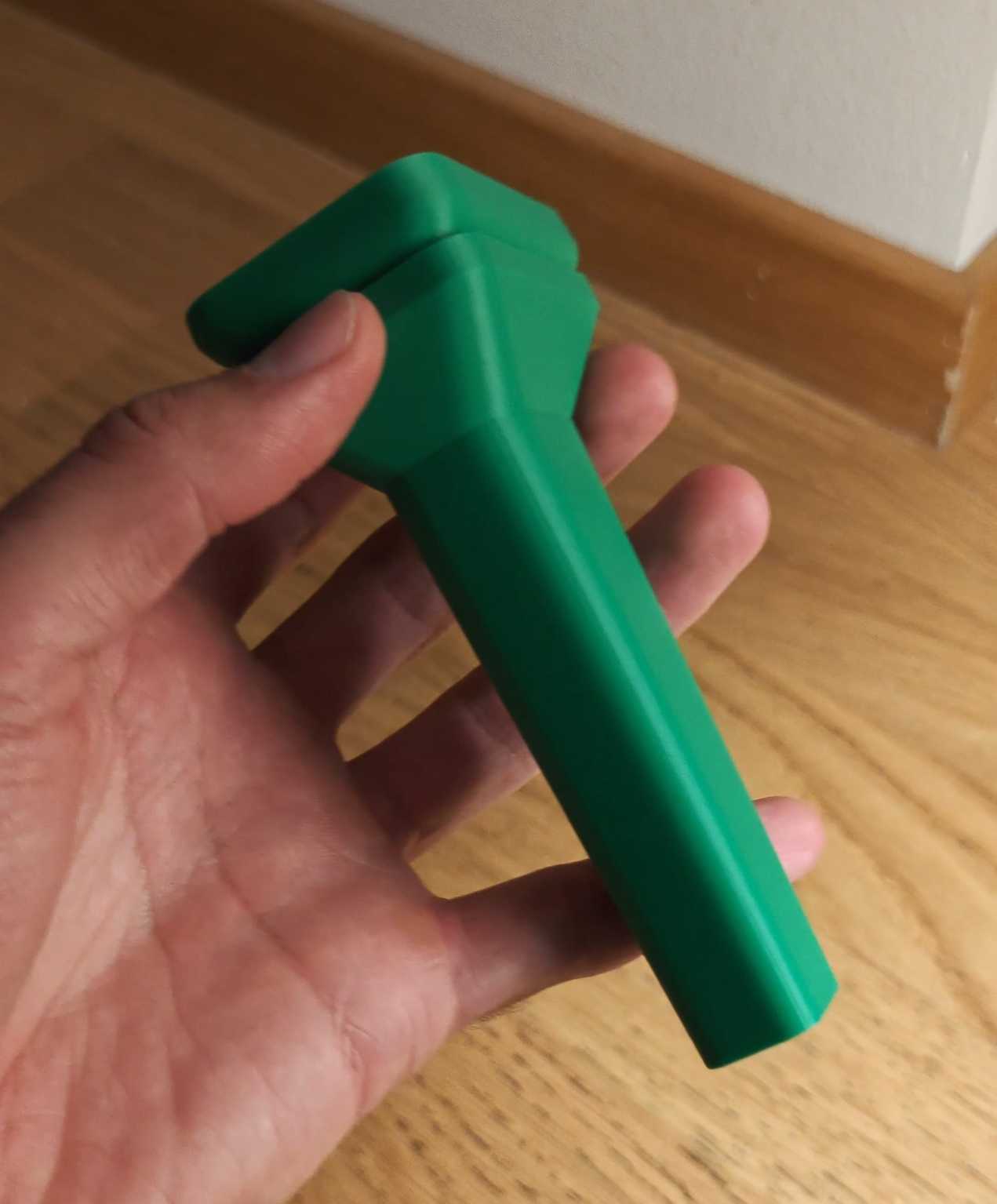 Green 3D-printed MicroDuck replacement sole and stilt prototype